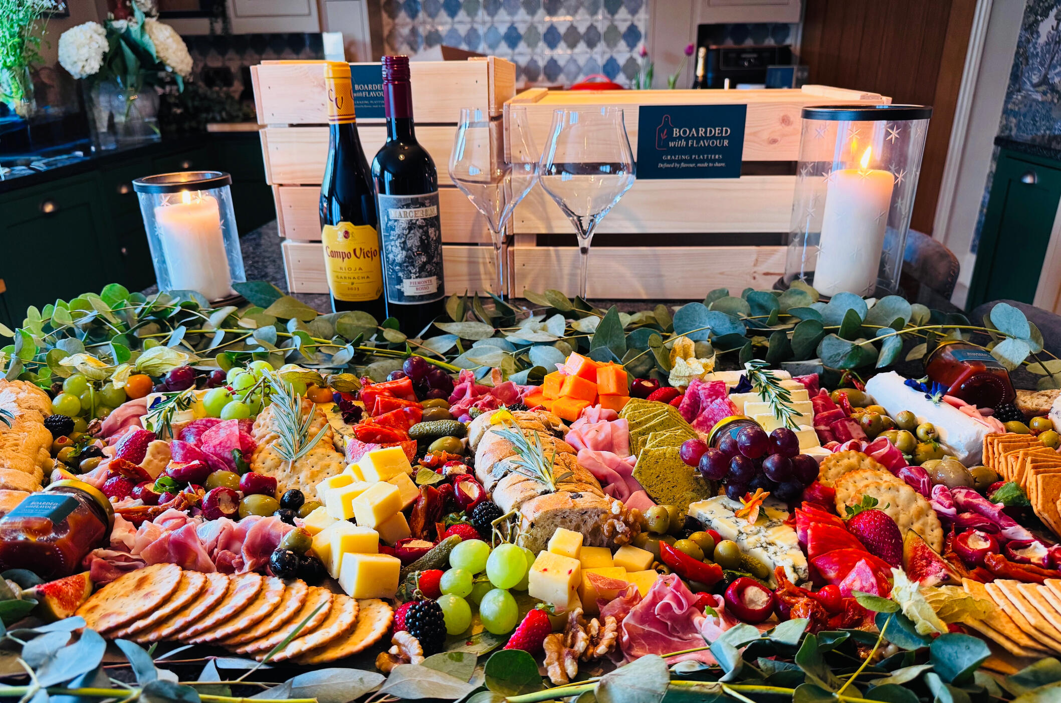 A small Indulge Event Table A small grazing table with a selection of charcuterie, mixed meats, fruits and cheeses